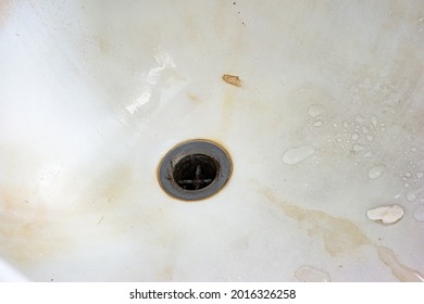 Very Dirty Bath Tub Close Of Shot With Sink-hole.