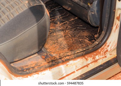 Very Dirty Car Interior With Sand And Mud Everywhere.