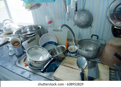 Very Dirty Kitchen, Dirty Dishes In Sink And Counter Top