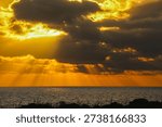 Very dramatic sky with the sunrays shining through dark clouds