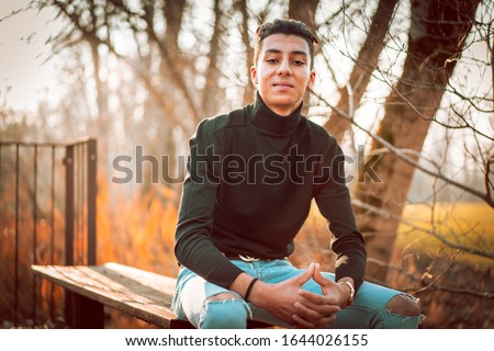 Very elegant moroccan boy. Lifestyle of beautiful moroccan boy. Moroccan boy in the park. Elegant teen boy from Morocco.