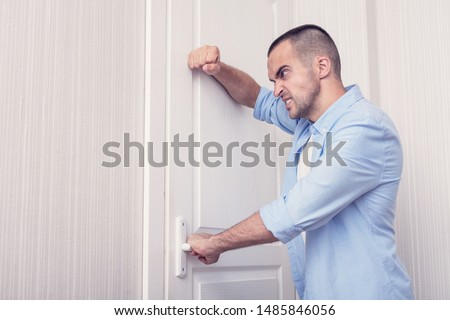 Very evil man knocking off a door, toned