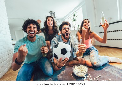 Very Excited Friends Having Fun By Watching Football Match And Eating At Home, Indoors. Friendship, Leasure, Rest, Home Party Concept