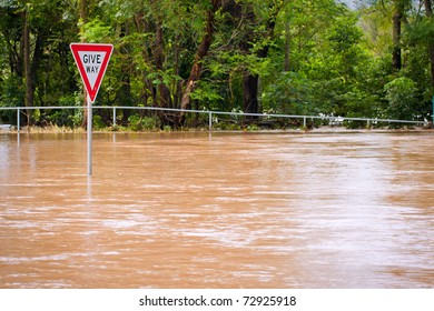 Very Flooded Road And Give Way Sign In Queensland, Australia