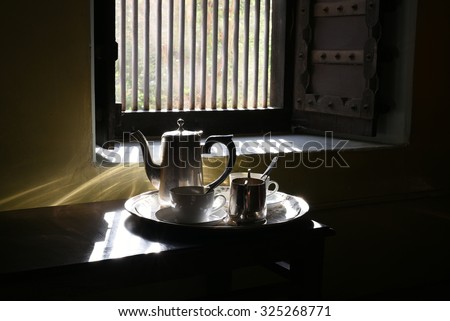 
Very Good Morning Tea set with shining silver utensils, Morning sunrise light coming through window is shining on the silverware, time for bright new day