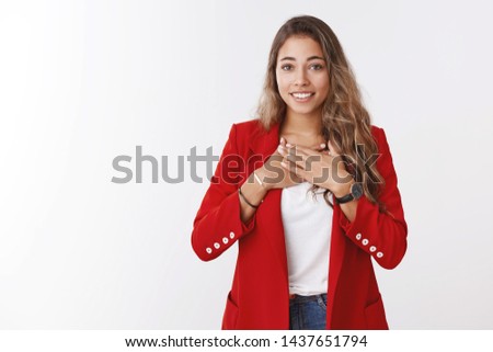 Very grateful young cute friendly-looking charming woman holding palms breast thankful smiling broadly thanking saviour help, receiving heartwarming gift, appreciate effort, white background