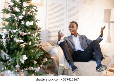 Very Happy Afro-american Man Can't Deal With The Emotions, He Is Very Surprised And Astonished On The Christmas Eve