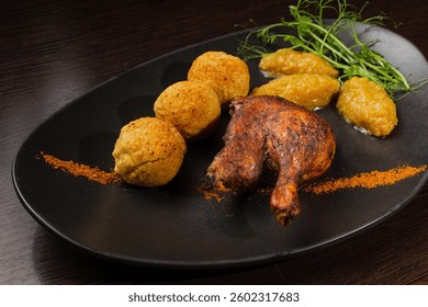 Very healthy roast duck thigh with potatoes and greens on a black plate on a wooden table serving in a restaurant. nice decoration of the dish. diet food in a restaurant. duck in the foreground - Powered by Shutterstock - Get 15% off with code: PIKWIZARD15