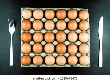 A Very Hungry Man Is Going To Eat A Whole Tray Of Eggs. Hungry Athlete After A Hard Workout Is Going To Eat Eggs. Eggs Are One Of The Main Sources Of Protein.