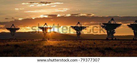 The Very Large Array, which is a large array of satellite dishes that is used to probe deep space (from Contact), is seen at sunset.