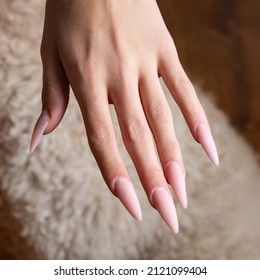 Very Long Extended Nails On A Thin Hand.