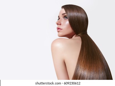 Very long, straight silky hair. The girl with long hair. Keratin straightening. Hair care.Fashion, beauty, skin care, hair care, cosmetologist, make-up artist, beauty salon, cosmetics.