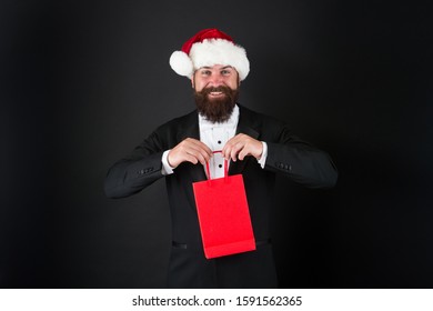 Very Merry Sale. Santa Boss Hold Shopping Bag. Happy Businessman Enjoy Discount Days. Happy Holidays. Merry Christmas. Happy New Year. Happy Holiday Season, Copy Space.