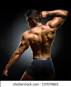 the very muscular back guy , naked  torso