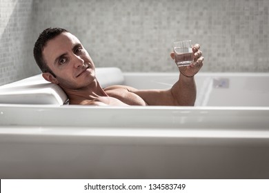 A Very Muscular And Fit Man Relaxing In A Luxury Bathtub