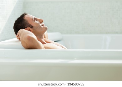 A Very Muscular And Fit Man Relaxing In A Luxury Bathtub