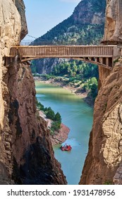 Very narrow bridge in rocky canyon - mountain wooden path along steep cliffs in Andalusia, Spain