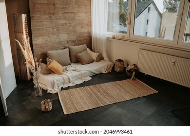 very nice apartment with kerzwn and cushions in a boho chic style perfect for a shooting or cozy hours together