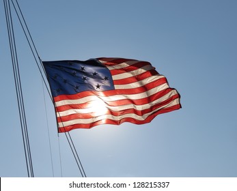 Very Nice Image Of American Flag Waving In Front Of Sun