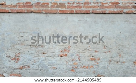 Similar – Background with plastered wall surface, bricks and wooden door