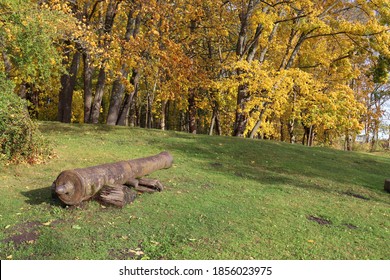 Very Old Cannon Barrel On The Green Edge Of The Autumn Forest