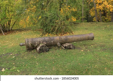 Very Old Cannon Barrel On The Green Edge Of The Autumn Forest