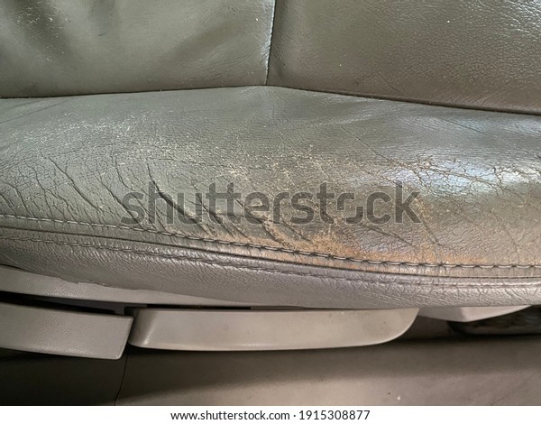 Very old car seat,\
artificial leather torn