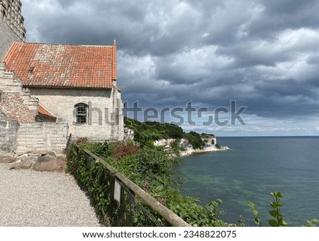A very old church near Mons Klint in Hojerup, Denmark. It was built so close to the rock that part of it has already eroded away.