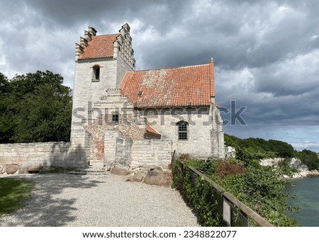 A very old church near Mons Klint in Hojerup, Denmark. It was built so close to the rock that part of it has already eroded away.