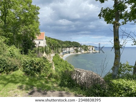 A very old church near Mons Klint in Hojerup, Denmark. It was built so close to the rock that part of it has already eroded away. You see the coastline an the wonderful view