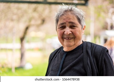 Very Old Happy Woman In House Backyard