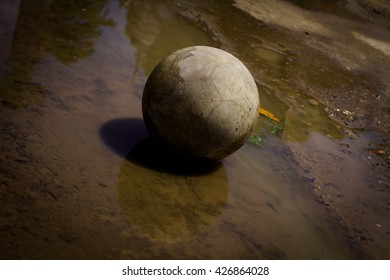 Very Old Soccer Ball On The Water 