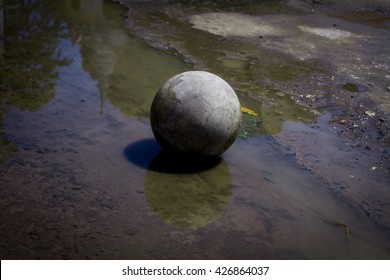 Very Old Soccer Ball On The Water 