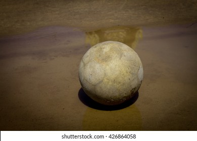 Very Old Soccer Ball On The Water 