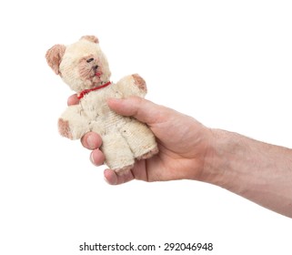 Very Old Teddybear In The Hand Of A Man