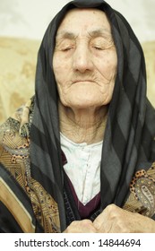 Very Old Woman Closed Eyes In Sorrow