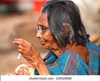 Very Old Woman Smoking Cigarette