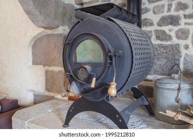 Very Old Wood Stove In A Fireplace.