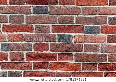 Very original solid stable brick wall as a background or texture. Unique masonry and color