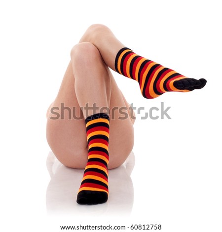 very relaxed woman lying on a white background wearing colored sock