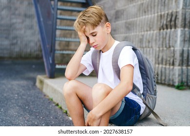 A Very Sad Boy Bullying In School Playground.