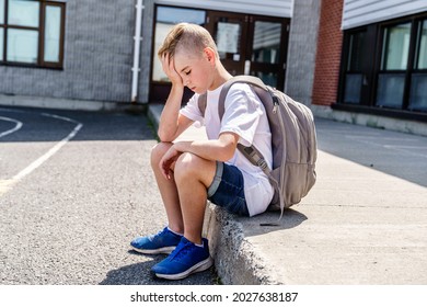 A Very Sad Boy Bullying In School Playground.