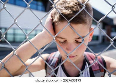 A Very Sad Boy Bullying In School Playground.