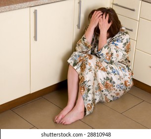 Very Sad Woman Sits On A Floor