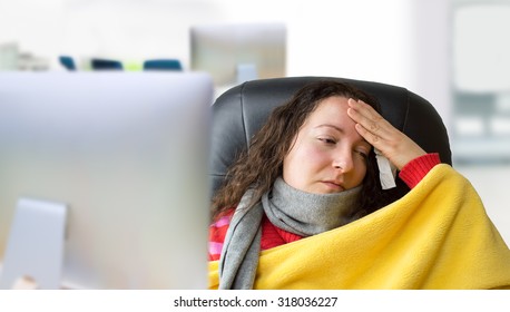 Very Sick Woman With Scarf And High Fever At The Office