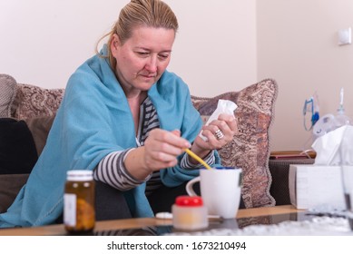 A Very Sick Woman With Temperature Drinks Warm Tea