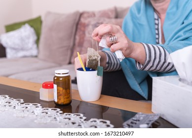 A Very Sick Woman With Temperature Drinks Warm Tea