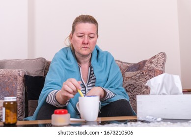 A Very Sick Woman With Temperature Drinks Warm Tea