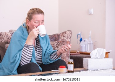 A Very Sick Woman With Temperature Drinks Warm Tea