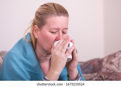 A Very Sick Woman With Temperature Drinks Warm Tea